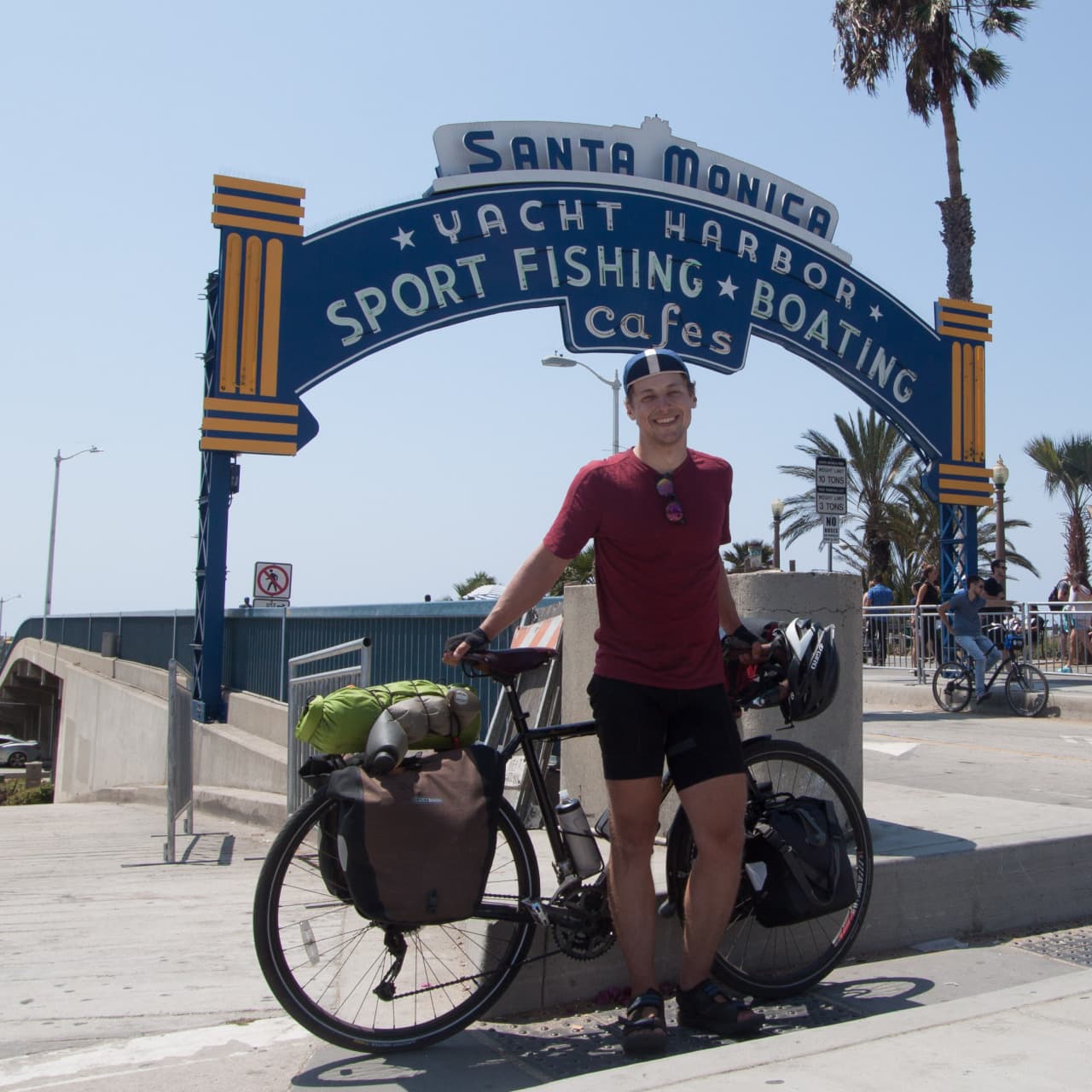 Me posting on the Santa Monica Pier at the end of my Pacific Coast bike tour